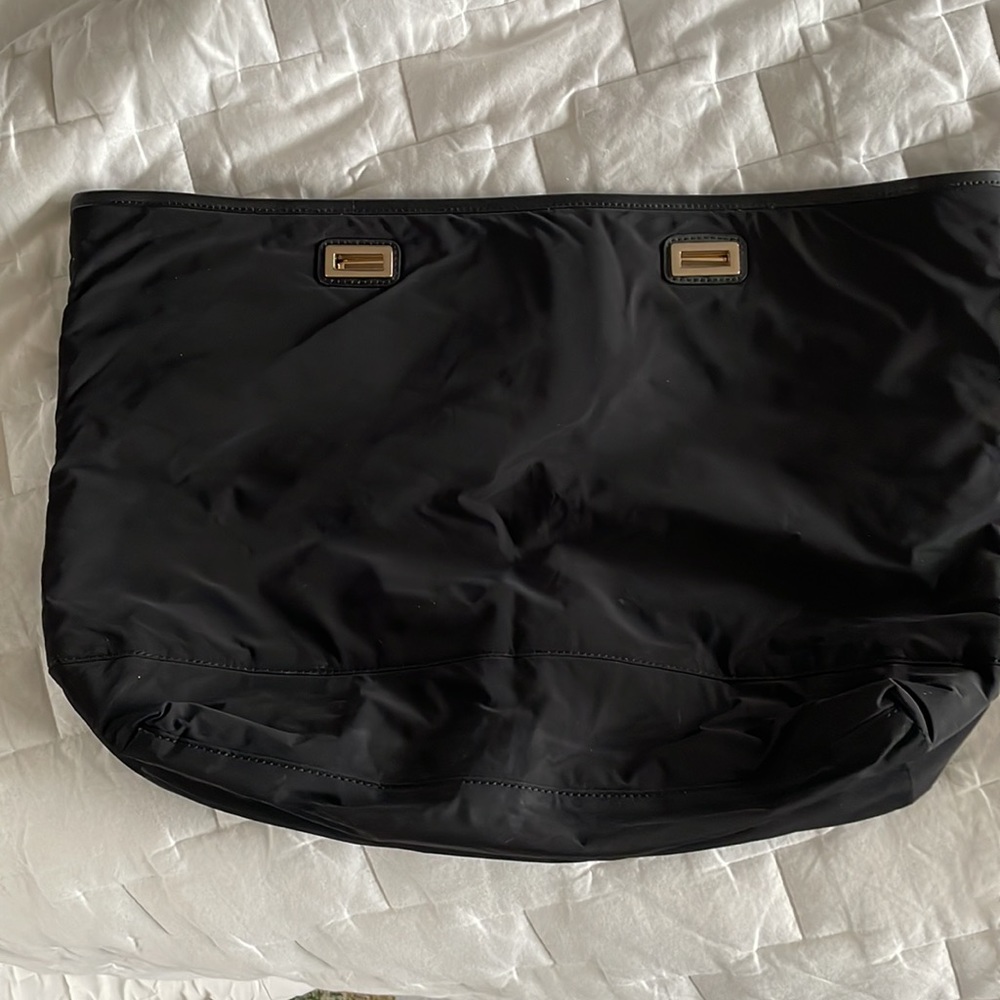 Lightly used Lo & Sons 15” nylon shell (great for traveling)